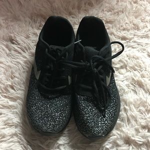 Black and gold sneakers